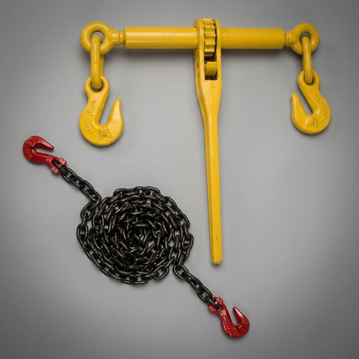 13 mm Grade 80 low loader lashing chain with red grab hooks shown alongside a yellow ratchet load binder, used to secure a tracked excavator on a flatbed trailer